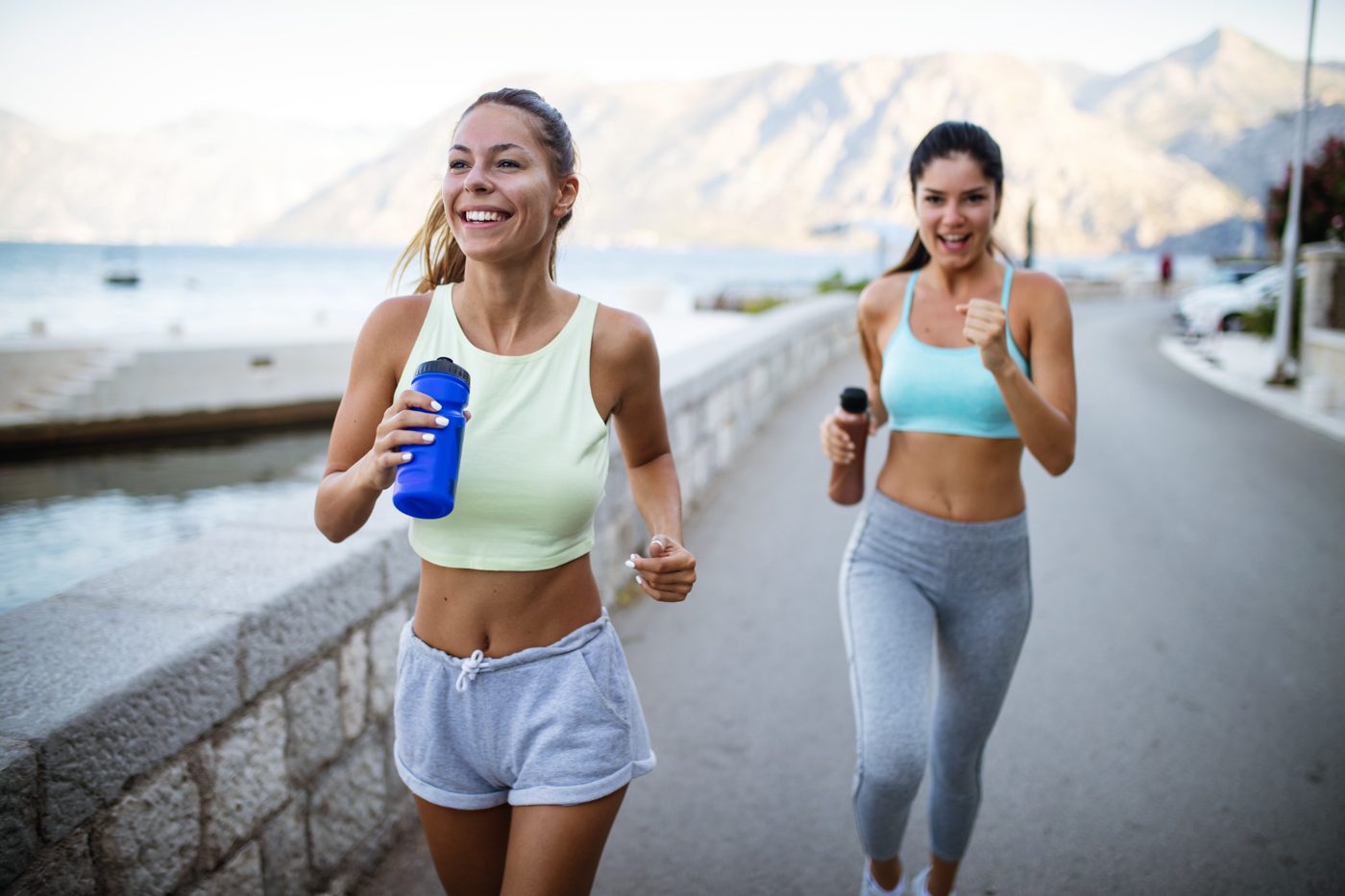 Jogging together beside the water